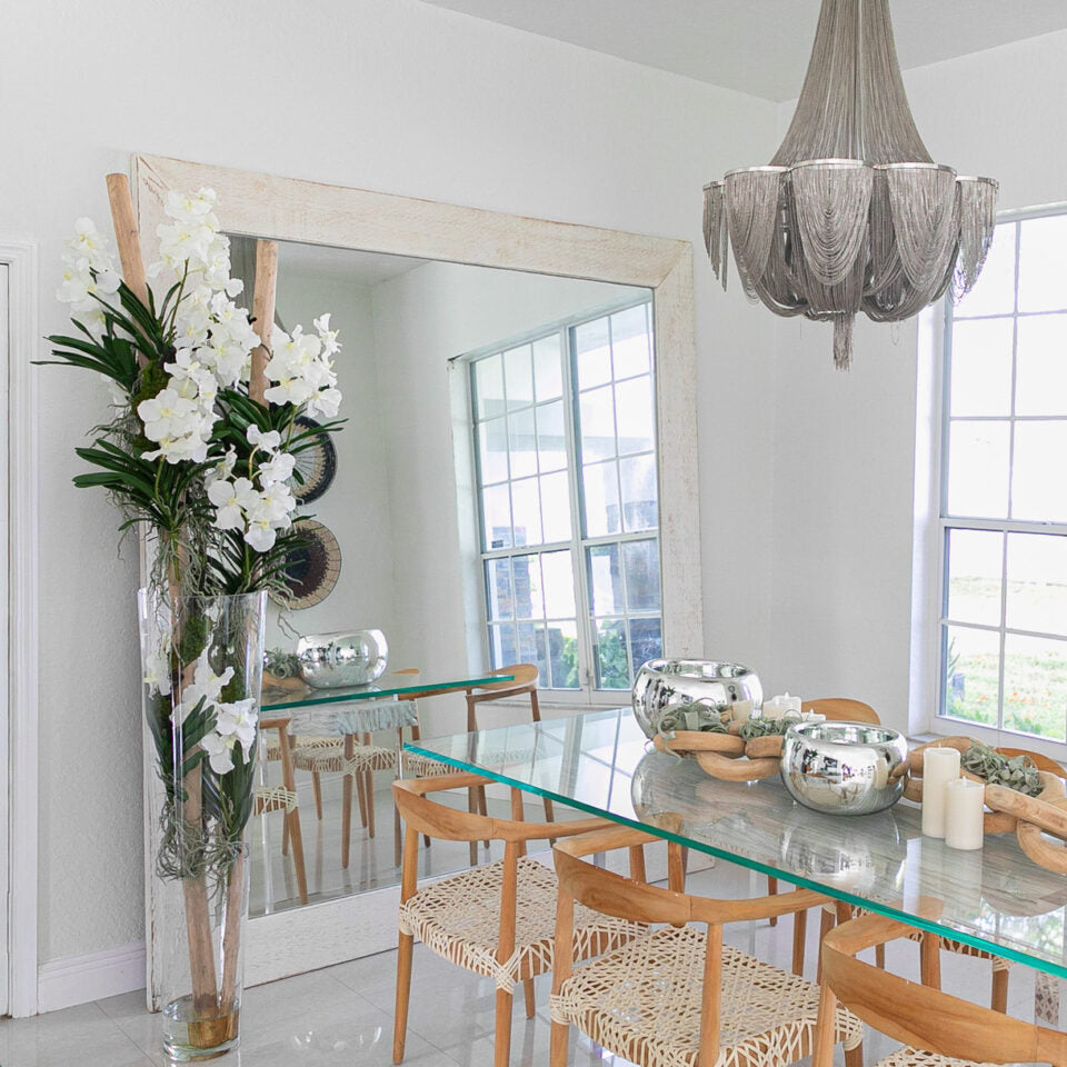 White Vanda Orchids and Driftwood Inside a Large Conical Glass Cylinder